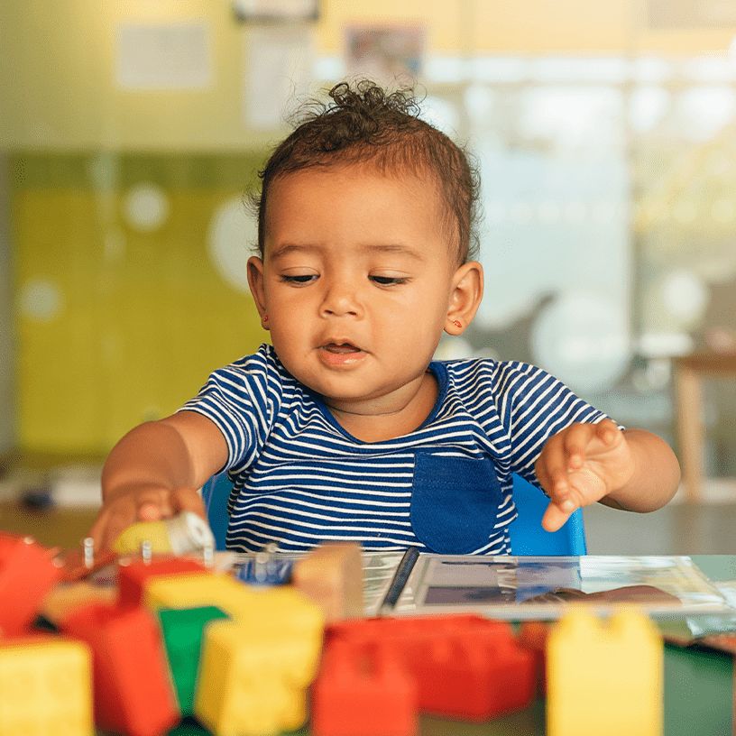 Baby playing with blocks.